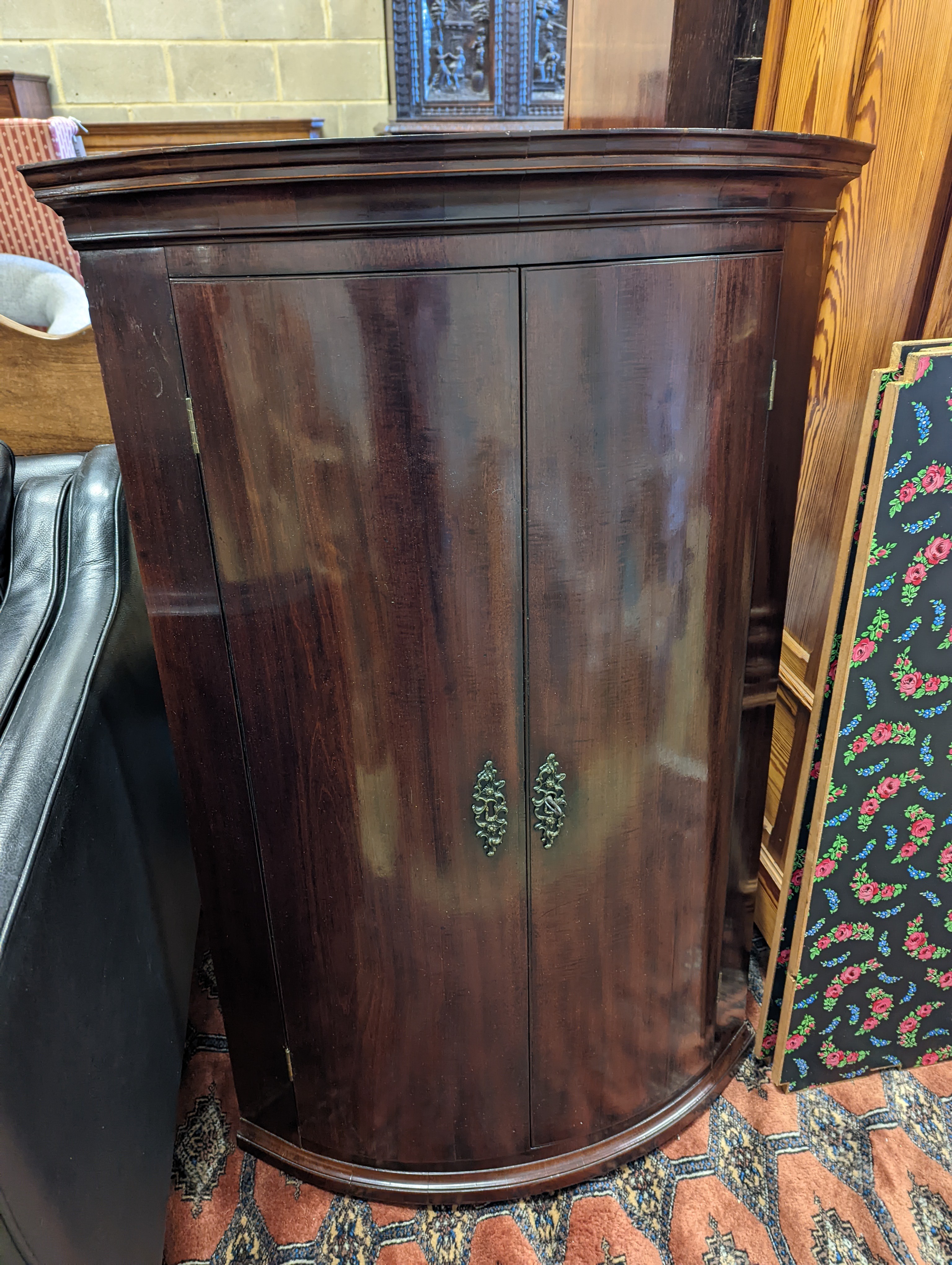 A George III mahogany bow front hanging corner cabinet, width 72cm, depth 50cm, height 109cm